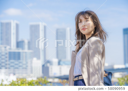 Business casual career woman, blue sky Business casual career woman, blue sky 58090959
