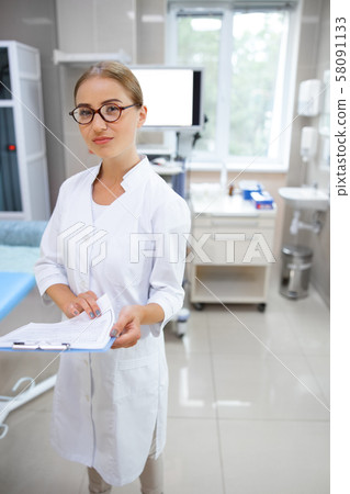 Young female doctor in ultrasound office stock photo 58091133