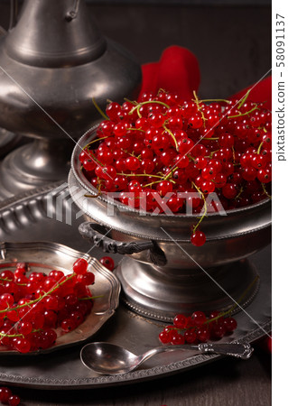 Fresh berries of red currant on a vintage Fresh berries of red currant on a vintage 58091137