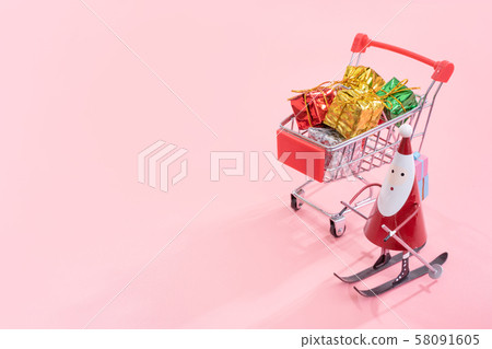 購物購物車生日出生老人深紅色背景購物車聖誕節購物 58091605