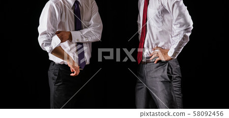 Two businessmen having a discussion 58092456