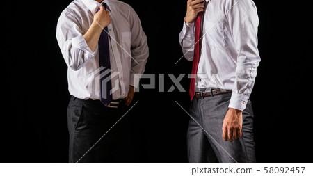 Two businessmen having a discussion 58092457