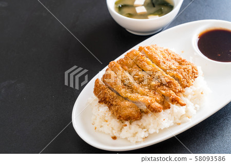 fried pork on topped rice (tonkatsu) with miso 58093586