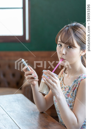 Female smartphone cafe lifestyle 1 person Female smartphone cafe lifestyle 1 person 58093896