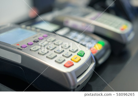 Credit card swipe machine And a young woman 58096265
