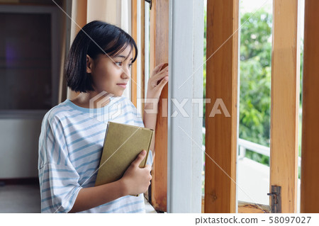 The girl hugged the holy scriptures The girl hugged the holy scriptures 58097027