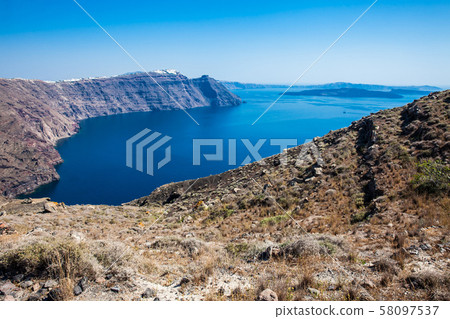 The beautiful landscapes seen from the walking path number nine between the cities of Fira and Oia in Santorini Island The beautiful landscapes seen from the walking path number nine between the cities of Fira and Oia in Santorini Island 58097537