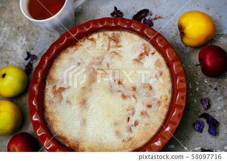 Apple pie and cup of tea on textured concrete background 58097716