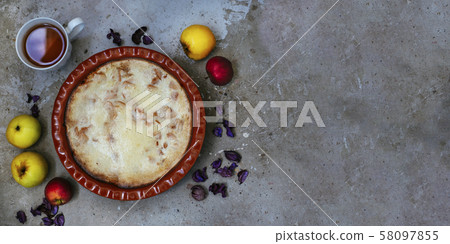 Apple pie and cup of tea on textured concrete background Apple pie and cup of tea on textured concrete background 58097855