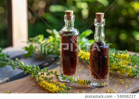 Two bottles of agrimony tincture with fresh plant Two bottles of agrimony tincture with fresh plant 58098237