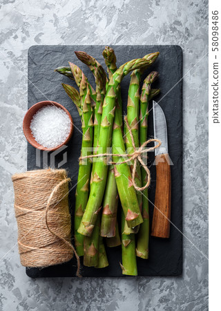 Green asparagus sprout on black board Green asparagus sprout on black board 58098486