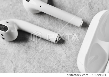 White wireless earphones or headphones with case. White wireless earphones or headphones with case. 58099301