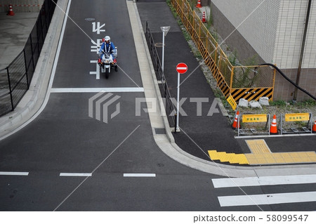 White bike watching at the intersection 58099547