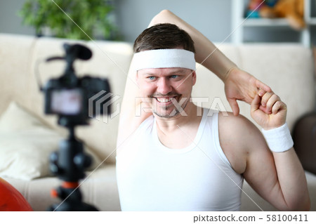 Man Vlogger Doing Exercise for Hands Portrait 58100411