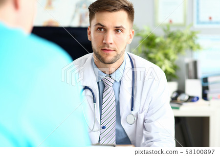 Thoughtful doctor in clinic 58100897