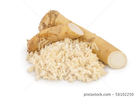 Horseradish root with slices grated pile isolated on white background 58102250