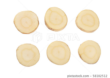 Parsnip root slices isolated on white background closeup. Top view. Flat lay. Set or collection 58102512