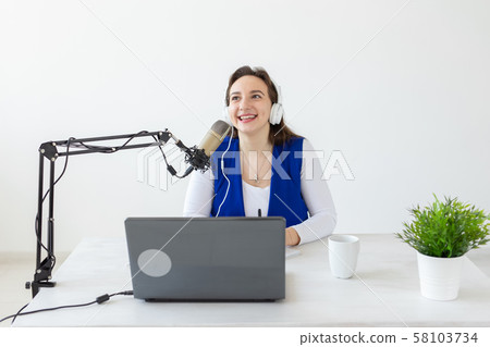 Radio, blogging, broadcast concept - Young woman working on the radio 58103734