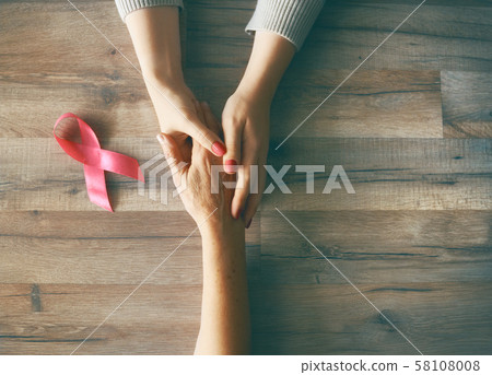 Females hands and symbol of Breast Cancer Females hands and symbol of Breast Cancer 58108008
