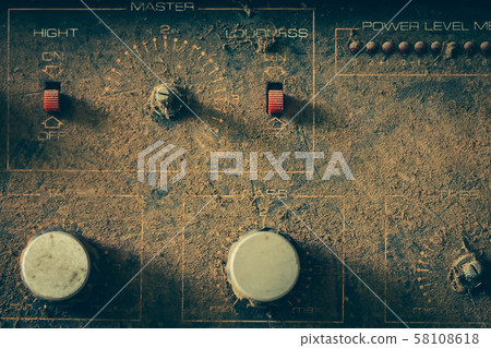 The old amplifiers damaged, placed on the table 58108618