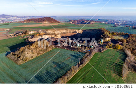 Aerial view of machinery in open gravel pit mining. Processing plant for crushed stone and gravel Aerial view of machinery in open gravel pit mining. Processing plant for crushed stone and gravel 58108691