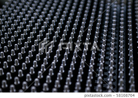 Close up shot of black screw thread bolts rowed up to a pattern background Art 58108704