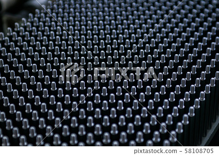 Close up shot of black screw thread bolts rowed up to a pattern background Art 58108705