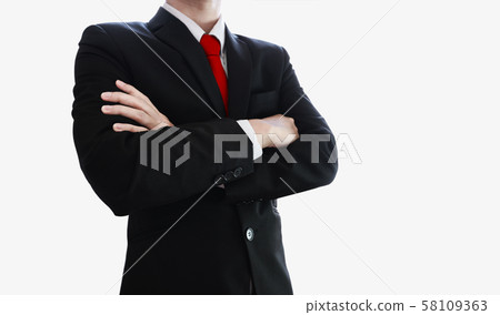 Businessman with red necktie and arm crossed, isolated 58109363