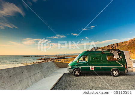 Sea coast and camper car, Andoya island Norway 58110591