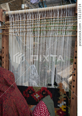 woman at work, carpet production, handmade.manufacture of carpet woman at work, carpet production, handmade.manufacture of carpet 58110714