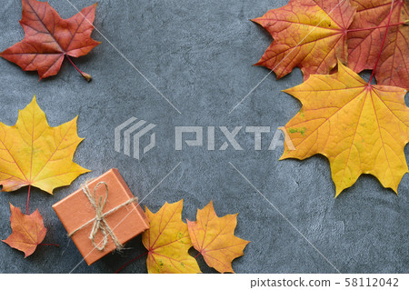 Autumn composition. Maple leaves and gift box. Flat lay, top view 58112042