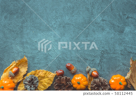 Autumn Leaves, decorative pumkins, acorns and cones over blue wooden background Autumn Leaves, decorative pumkins, acorns and cones over blue wooden background 58112445