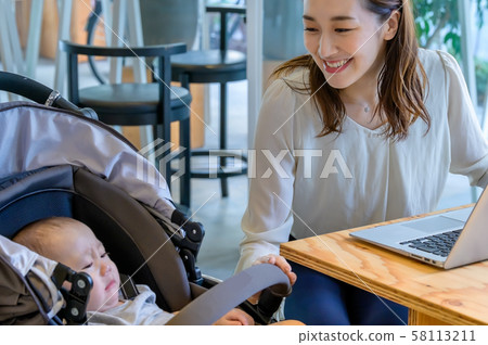 Mother peeking through stroller Mother peeking through stroller 58113211