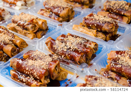 Fried spring rolls or Popiah is a famous Malaysian traditional street food with selective focus 58114724
