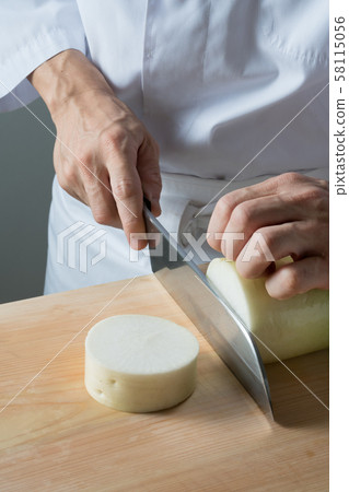 In front of a board to cut radish 58115056