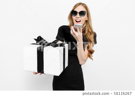 young girl in a black dress and sunglasses, young girl in a black dress and sunglasses, 58116267