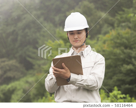 Smiling construction worker Smiling construction worker 58116464