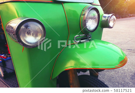 Close up modern detail light car and vintage.green Taxi Thailand.Tuk Tuk car in Thailand. Close up modern detail light car and vintage.green Taxi Thailand.Tuk Tuk car in Thailand. 58117521