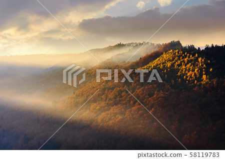 autumnal mountain landscape at foggy sunrise 58119783