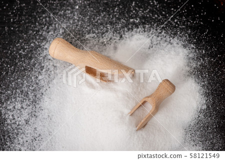 Top view of two scoops with baking soda on wood Top view of two scoops with baking soda on wood 58121549