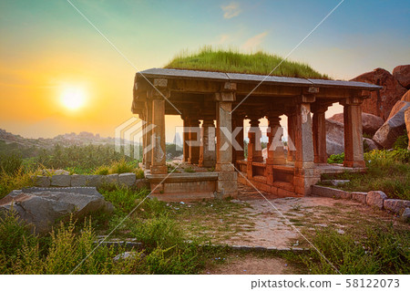 Ancient ruins in Hampi on sunset. India 58122073