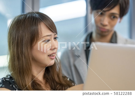 Business man preparing meeting materials on computer Business man preparing meeting materials on computer 58122288