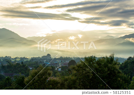 colorful dramatic sky with cloud at sunset. 58125351