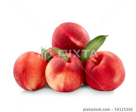 Nectarine peaches with slice and leaf isolated on 58125392