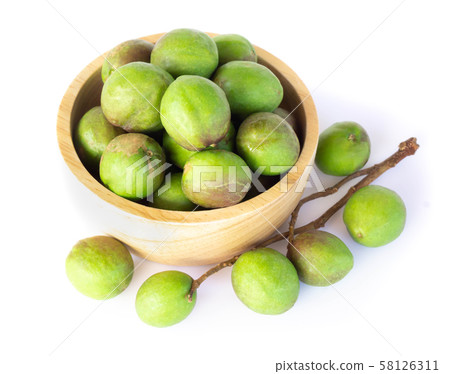 Chebulic Myrobalans in wood bowl isolated on white 58126311