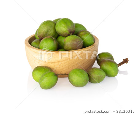 Chebulic Myrobalans in wood bowl isolated on white Chebulic Myrobalans in wood bowl isolated on white 58126313
