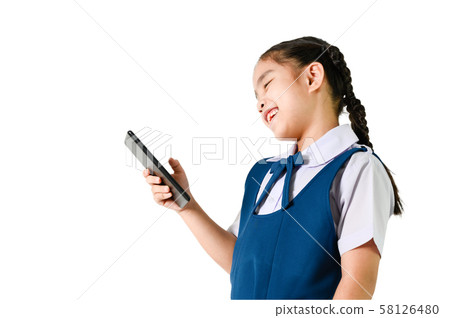 portrait of smiling, little girl in school uniform portrait of smiling, little girl in school uniform 58126480