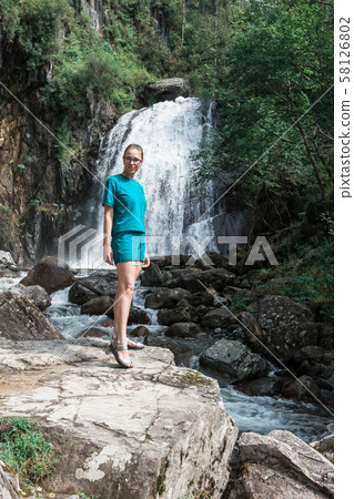 Woman at Korbu Waterfall Woman at Korbu Waterfall 58126802