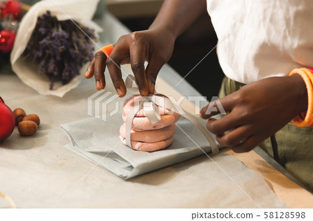 Focused photo on female hands that serving present Focused photo on female hands that serving present 58128598