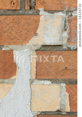 Close-up of brick wall dirty with concrete drips Close-up of brick wall dirty with concrete drips 58128710